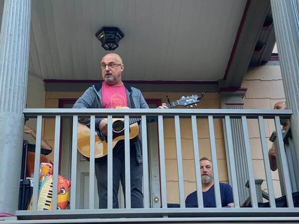 Jim and band playing on a porch