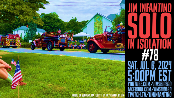 fourth of july parade rolling by in a small town with poster for a performance