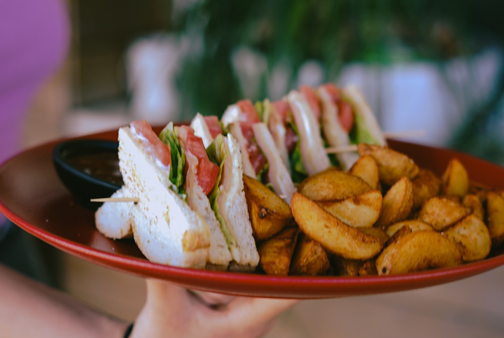 A club sandwich with fries