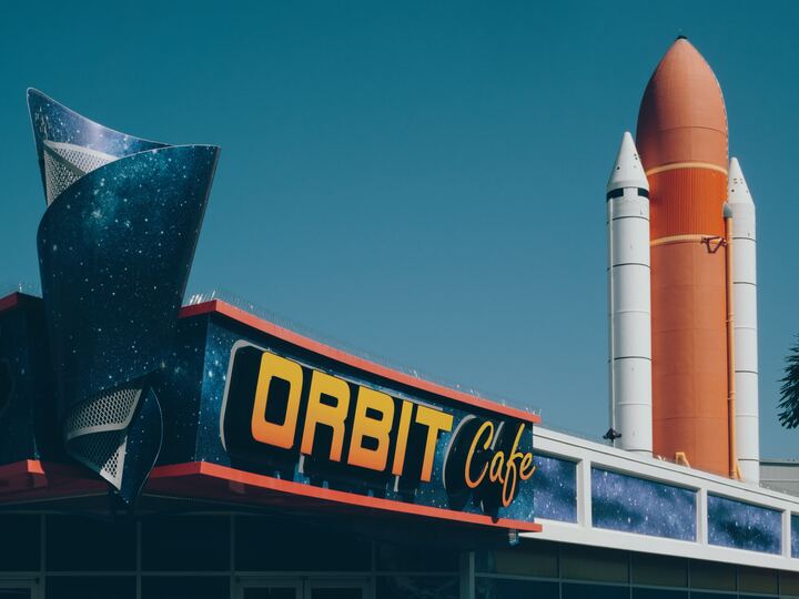 image of cafe with space shuttle parts behind